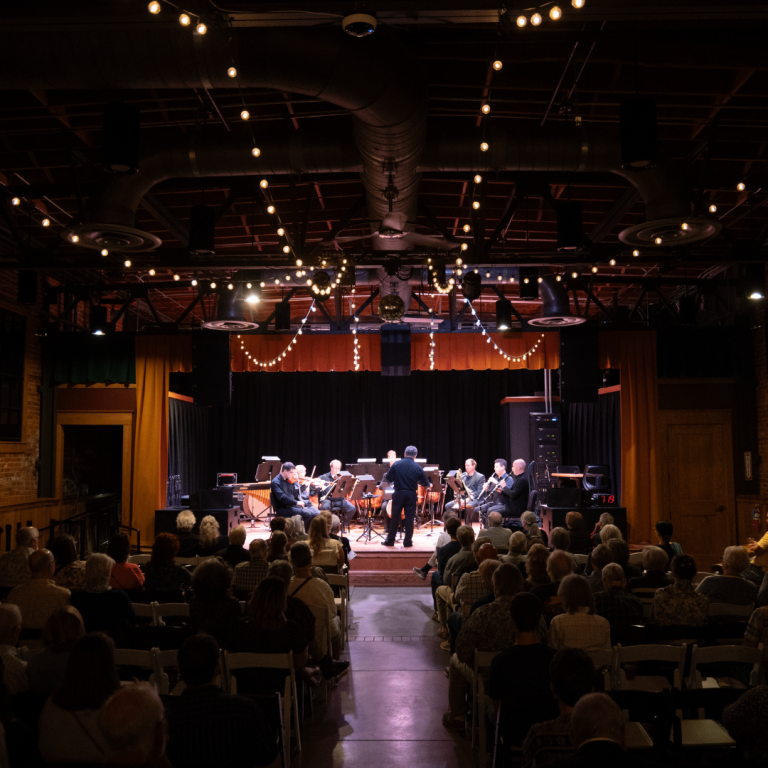 a symphony ensemble performs in the backroom of bell's brewery