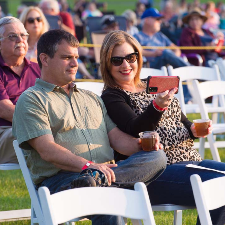 couple enjoying a concert outside