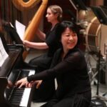 symphony prinicpal keyboard reiko yamada smiles while performing