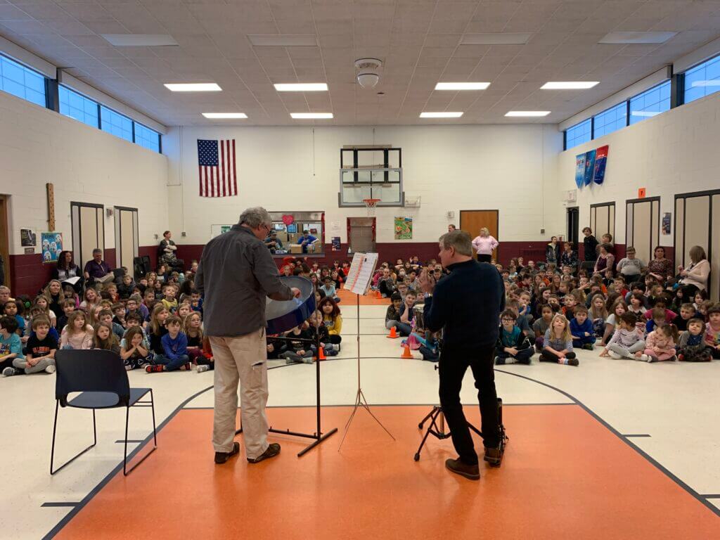 two percussionists play for students - school music