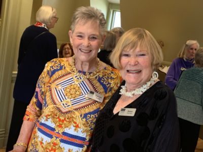 symphony league members smile while at an event